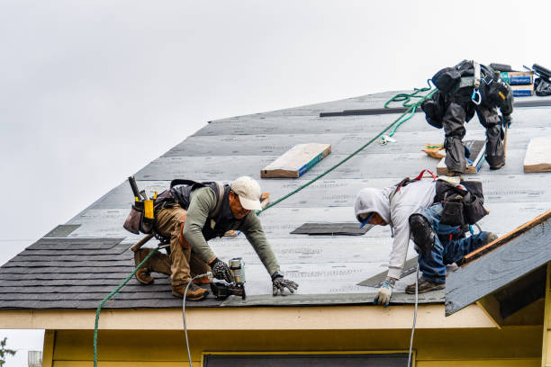 Professional Roofing technician working in Wellston, MO